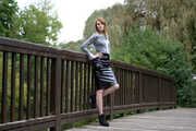 Miss Petra in a hot vinyl skirt, high heels and transparent blouse at photo shooting