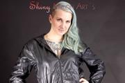 Mara wearing a sexy black shiny nylon shorts and a black rain jacket posing for you (Pics)