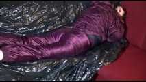 Watching Lucy preparing her sofa with a black shiny nylon cloth for lolling with a sexy purple downsuit on the sofa (Video)