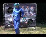 Mara wearing a blue rainwear combination while playing soccer with herself (Video)