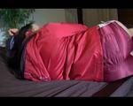 Lucy wearing a sexy red shiny nylon shorts and a red rain jacket lolling in bed (Video)