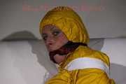 Watching Pia being tied and gagged with tape and a cloth gag wearing sexy yellow shiny nylon rainwear (Pics)