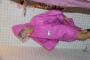 Watching Sandra wearing only a pink shiny nylon raincape under the shower playing with the water (Pics)