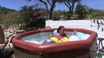 a jakuzzi full of balloons