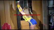 ***NEW MODEL*** Sandra wearing highheels and a sexy blue/yellow shiny nylon shorts and a yellow top tied and gagged with ropes (Video)