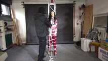Aiyana in a shiny nylon red rainsuit and a see through PVC Rainjacket, tied gagged, hooded and vibed