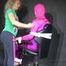 Sexy Pia tied and gagged with ropes and a clothgag on a hairdresser´s chair wearing a sexy pink shiny nylon downsuit (Video)