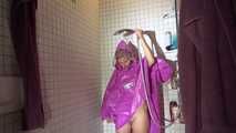 Watching Sandra wearing only a pink shiny nylon raincape under the shower playing with the water (Video)