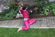 Watching Aiyana wearing supersexy pink shiny nylon rainwear while planting flowers in the garden (Pics)