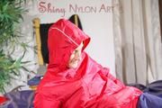 Sonja lolling on bed with a sexy blue rain pants and a red rain jacket enjoying herself and the hood in this material (Pics)