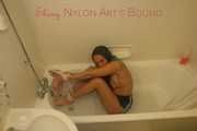 Stella tied and gagged with ropes and a cloth gag in a bath tub wearing ONLY a sexy black shiny nylon shorts (Pics)