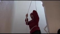 Jill ties, gagges and hoodes herself on a strairway wearing sexy shiny nylon rainwear (Video)