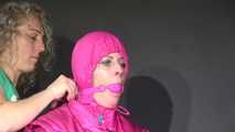 Sexy Pia tied and gagged with ropes and a clothgag on a hairdresser´s chair wearing a sexy pink shiny nylon downsuit (Video)