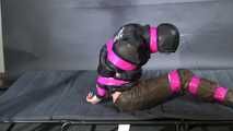 Marie M bound and gagged in shiny nylon Downwear trying to escape