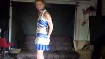 Red haired Woman bound and gagged in a shiny wetlook Cheerleader Dress