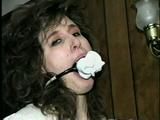 ERICA IS RING GAGGED, MOUTH STUFFED, CLEAVE GAGGED & TIED WITH BLACK NYLON ROPE (D36-10)