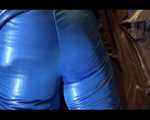 Jill putting on a sexy blue shiny nylon down suit and lolling on bed (Pics)