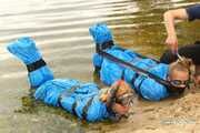 Dana and Asya - both ends up packed in trash bags in the water