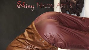 Watching ***SONJA*** wearing a sexy brown shiny nylon rainwear combination preparing her bed an lolling in the bed (Pics)