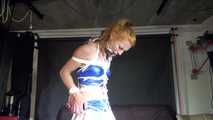 Red haired Woman bound and gagged in a shiny wetlook Cheerleader Dress