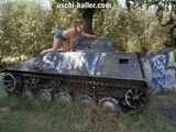 Nathalie poses on a Hotchkiss armored personnel carrier