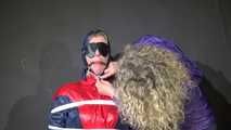 Watzching sexy PIA wearing a sexy oldschool rainwear combination in red/blue sitting on a hairdresser´s chair being tied and gagged from Sophie (Video)