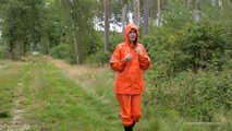 Miss Petra takes a walk in a orange AGU rain suit and rubber boots