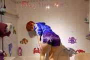 Sonja wearing a sexy purple shiny nylon shorts and a blue rain jacket while taking a shower (Pics)
