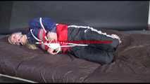 SANDRA wearing sexy shiny nylon rain pants and an oldschool rain jacket tied and gagged on bed with ropes and ball gag (Video)