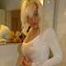 Natural beauty Martina posing in white shirt, black thong and stockings in bathroom