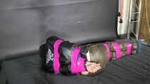 Marie M bound and gagged in shiny nylon Downwear trying to escape