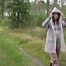 Miss Petra takes a walk in an AGU rain suit, transparent rainsuit and rubber boots (looped version)