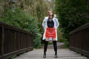 Miss Petra in hot vinyl skirt, overknee boots and raincoat at the photo shoot