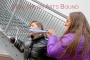 One archive girl tied and gagged by another archive girl outdoor wearing shiny down jackets (Pics)