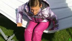 Watch Sandra enjoying the Summer in her shiny nylon Downwear