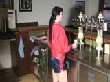 Jill in a bar wearing a sexy blue/red shiny nylon shorts and a red rain jacket (Video)