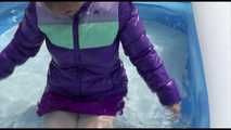 Watching Mara wearing a supersexy purple down skirt and a purple down jacket cleaning the swimming pool and playing with water (Video)