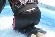 Watching sexy Mara going into the swimming pool wearing a sexy black/pink rainwear combination (Pics)