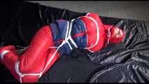 SANDRA tied, gagged and hooded on the floor wearing a supersexy oldschool red/blue down suit (Video)