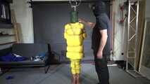 Ms Ungeniert tied, gagged and hooded in shiny nylon yellow Downjacket