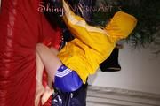 Sonja wearing a sexy blue shiny nylon shorts and a yellow rain jacket preparing her bed (Pics)