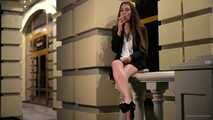 Ksenia is smoking near her office after a working day