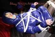 Sexy Sonja being tied and gagged on a stool with ropes and a clothgag wearing sexy shiny nylon dowmwear and a rain cape  (Pics)