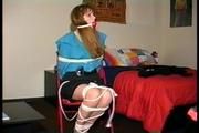 19 YR OLD NURSE'S AID  GETS BANDANNA GAGGED, HOME MADE LEATHER STRAP GAGGED, BALL-GAGGED AND TIED TO A CHAIR WITH ROPE (d-71-09)