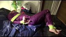 Pia tied and gagged on a bed with shiny nylon cloth wearing a supersexy purple rainjacket and rainpants (Video)