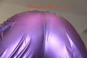 Jill tied and gagged on a table wearing a shiny purple/silver PVC sauna suit (Pics)