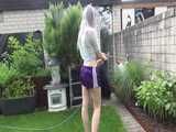 Get a video with Chloe enjoying gardening in her shiny nylon Shorts