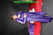 Sandra preparing her shiny nylon bed wearing sexy purple shiny nylon shorts and a purple shiny nylon rain jacket (Pics)