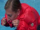 Watch Sandra enjoying the Pool during a hot summer Day with her shiny nylon Downjacket