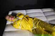 Get Pictures of Pia bound and gagged in her yellow shiny nylon Rainwear